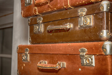Poster - stack of old retro suitcases close up