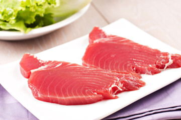 Wall Mural - Raw Tuna steak. Raw fish on a plate.