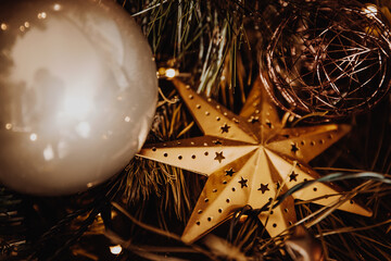 Golden star christmas decoration. Christmas tree decoration background. 