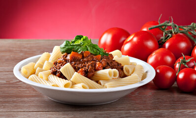 Sticker - Macaroni Bolognese on a plate. Typical Italian dish.