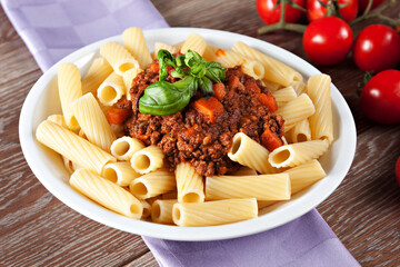 Macaroni Bolognese on a plate. Typical Italian dish.