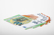 © Stockhausen - 100 and 50 Euro bank notes in a row on pink background