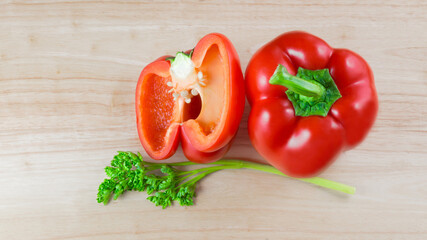 Bulgarian red ripe pepper on a wooden background