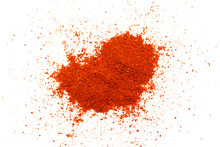 Red pepper powder isolated on white background, top view. Heap of red pepper powder on a white background. Cayenne pepper powder, top view. Pile of red paprika powder isolated on white background.