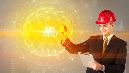 Handsome businessman with helmet drawing JOIN TODAY inscription, social construction concept