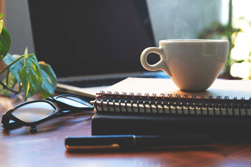 coffee on a black table showing break or breakfast in the office