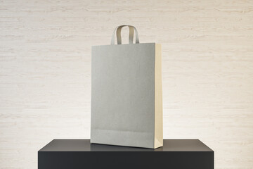 Poster - Paper bag with handles on podium.