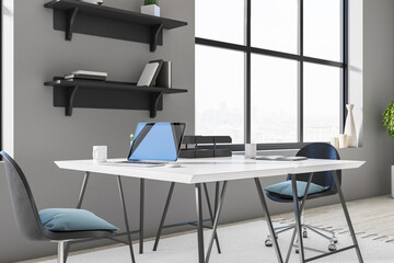 Aufkleber - Designer desktop with laptop on wooden table,