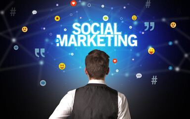rear view of a businessman with social marketing inscription, social networking concept