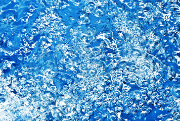 Wall Mural - Boiling water bubbles. Air bubble background. Fizzy water texture.