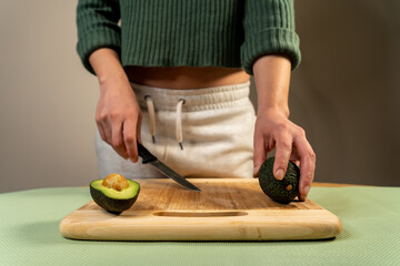 Sticker - A person cutting avocados for sushi