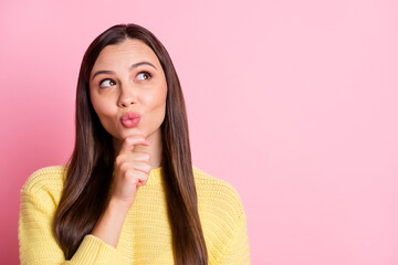 Sticker - Photo of charming dreamy young lady wear casual yellow outfit finger chin looking empty space isolated pastel pink color background