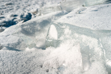 Ice hummocks on a frozen river. Huge chunks of ice close-up. Winter background