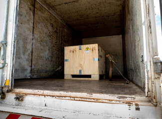 Wall Mural - Radiation label beside the transport wooden box Type A package in the truck