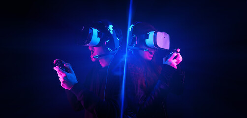 Wall Mural - gamers with virtual reality headsets and gamepads.