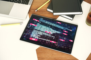 Poster - Modern digital tablet monitor with abstract programming language, research and development concept. Top view. 3D Rendering