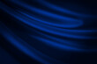 Leinwandbild Motiv Black blue abstract background. Dark blue silk satin texture background. Shiny fabric with wavy soft pleats. Dark blue elegant background with copy space for your design. Liquid wave effect.