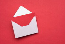 Closeup View Photo Of White Open Envelope And Red Bright Greeting Card Inside Isolated On Vivid Background