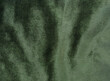 olive green velvet fabric for background. abstract wavy shiny fabric for luxury concept background. 