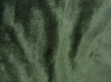 Olive Green Velvet Fabric For Background. Abstract Wavy Shiny Fabric For Luxury Concept Background. 