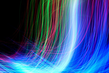 Wall Mural - Abstract motion curved lights on dark background