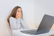 © QKon Studio - Emotional portrait of attractive cute girl 6-7 old experiencing fear and stress, sitting using laptop, white background