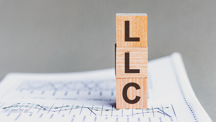 Sticker - letter of the alphabet of LLC on a grey background. LLC - Limited liability company