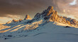 Wide landscape of mountains with snow at sunset in the Italian Dolomites