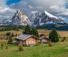 Landscape in the Italian Dolomites with first snow covering the peaks and autumn colors all around