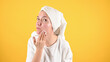 © Tatsiana - Young woman using gentle foam facial cleanser. Attractive woman washing her face with foam soap. Problem skin concept.