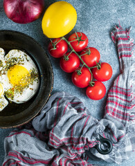 Tasty breakfast with fried egg on grey table