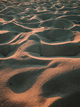 A Vertical Shot Of Texture Of Sand In A Wave Mode On The Coast Of The Sea