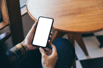 cell phone blank white screen mockup.woman hand holding texting using mobile on desk at office.background empty space for advertise.work people contact marketing business,technology