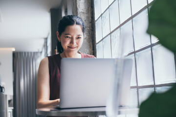 woman work using computer hand typing laptop keyboard contact us online chatting search form internet sitting at office.concept for technology device communication business people