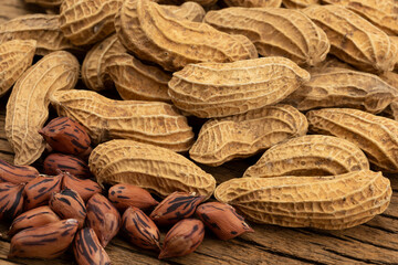 Pile of Tiger peanuts on wooden background