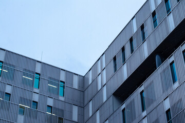 Sticker - A closeup shot of the last floor of a modern apartment building. Dark blue beautiful architecture