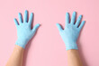 © Pixel-Shot - Hands in protective gloves on color background