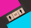© Ana Baraulia - Concepts of gender equality. wooden cubes with female and male symbol and equal sign. Equal pay social quaranty concept