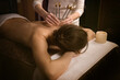 © Natalia Navodnaia - woman getting treatment. Acutonic relax massage and sound healing. Tuning forks