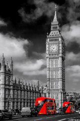 Fototapete - Big Ben with red buses on the bridge during sunny day in London, England, UK