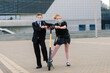 © Ivan Zelenin - Happy school children with backpacks and scooters outdoors in protective mask