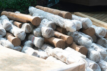 A Bundle Of Smooth Wooden Logs For Building A Building.
