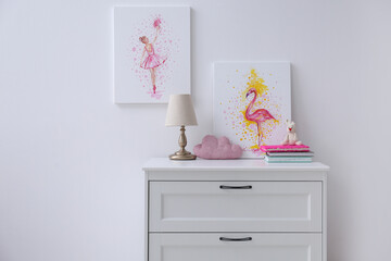 Poster - chest of drawers and beautiful pictures in children's room. interior design