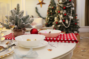 Dirty dishes on white table in room. Mess after new year party