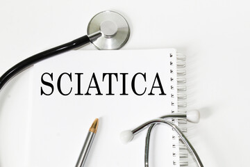 medical text SCIATICA on the card. white background, stethoscope, medicine. medical concept