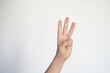 © Studio Roux - isolated child hand shows the number three. young hand gesture sign.