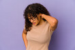 Young african american afro woman isolated having a neck pain due to stress, massaging and touching it with hand.