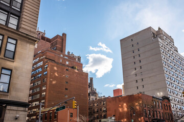 Wall Mural - A cloud in between buildings 