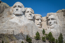The Carved Busts Of George Washington, Thomas Jefferson, Theodore “Teddy” Roosevelt, And Abraham Lincoln At Mount Rushmore National Monument