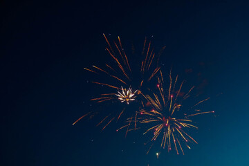 Real fireworks in the night with a dark blue sky Background